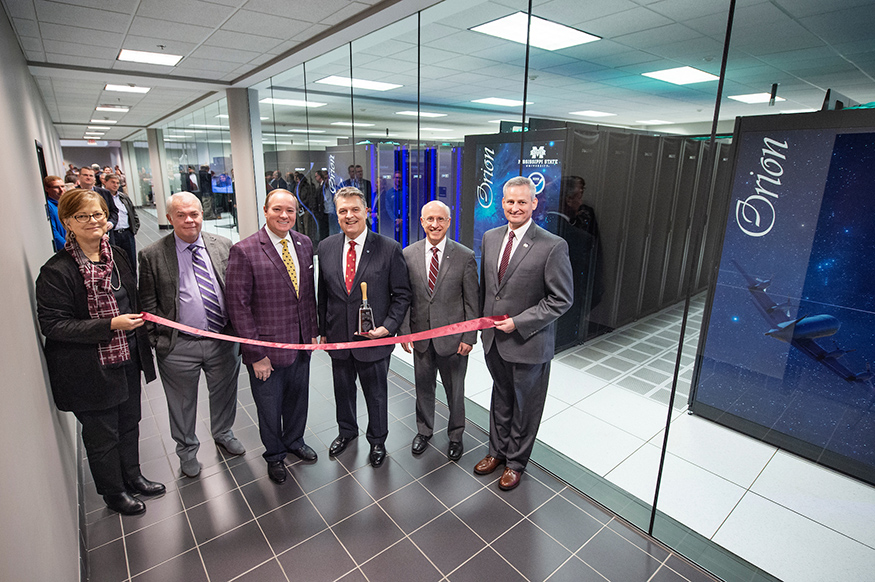 MSU and NOAA personnel cut a ribbon for the Orion supercomputer